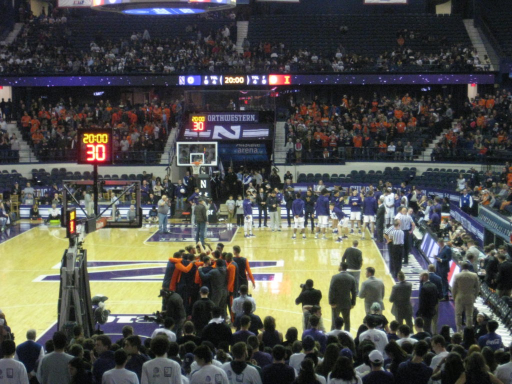 Northwestern Illinois basketball pre-game huddle
